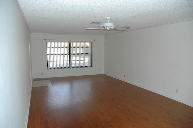 unfurnished room with ceiling fan, dark hardwood / wood-style floors, and a textured ceiling