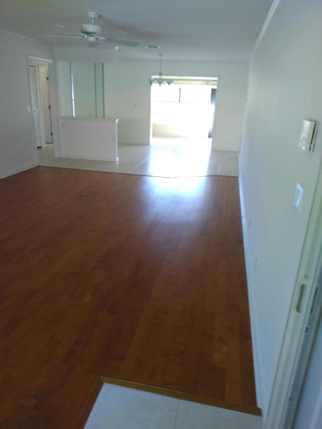 unfurnished room featuring hardwood / wood-style floors and ceiling fan