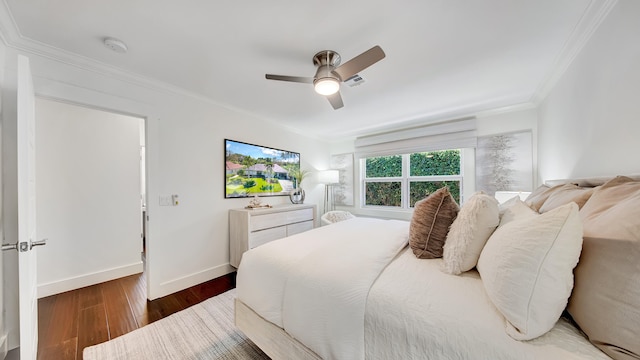 bedroom featuring ceiling fan, dark hardwood / wood-style flooring, and crown molding