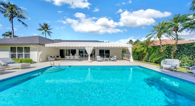 view of swimming pool featuring a patio area