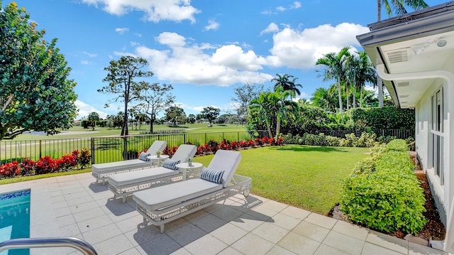 view of patio featuring a fenced in pool