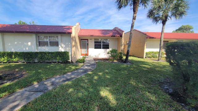 view of front of house with a front lawn