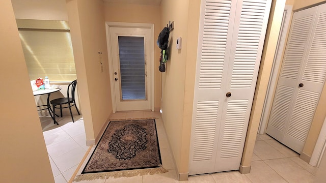 interior space featuring light tile patterned flooring