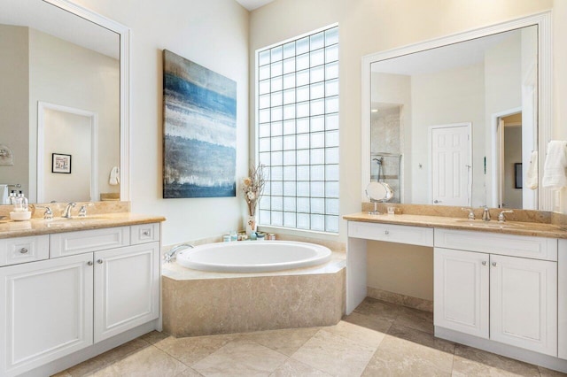 bathroom with vanity, a healthy amount of sunlight, and plus walk in shower