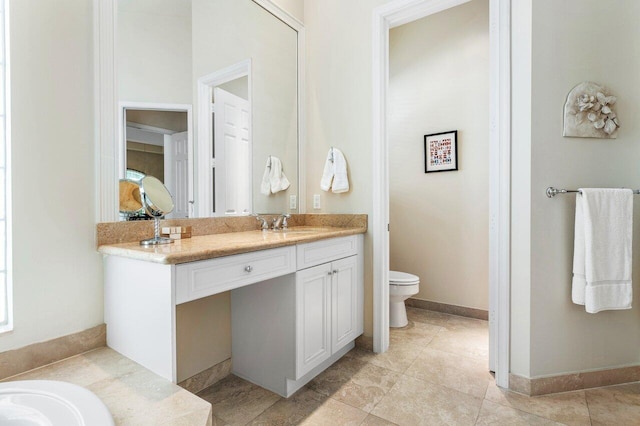 bathroom with tile patterned floors, vanity, and toilet