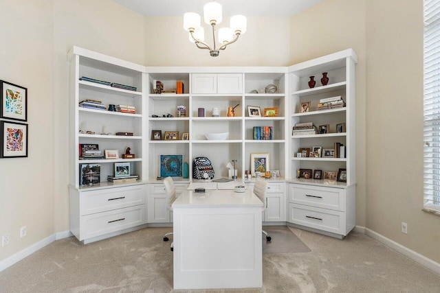 office area with a notable chandelier and light colored carpet