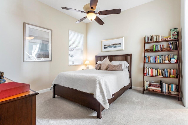 bedroom featuring light colored carpet and ceiling fan