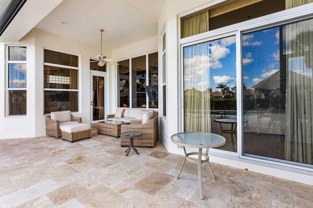 view of patio featuring ceiling fan