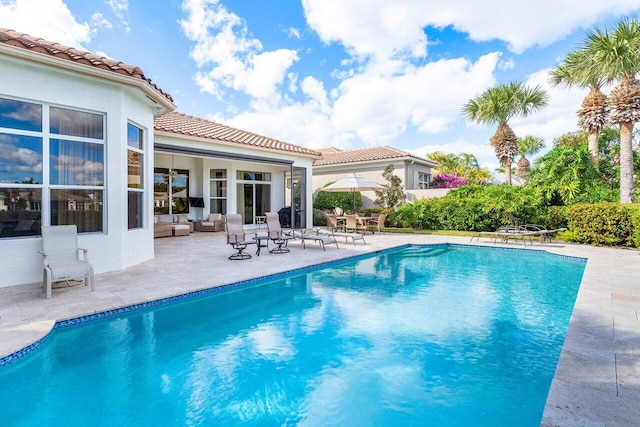 view of swimming pool featuring a patio area