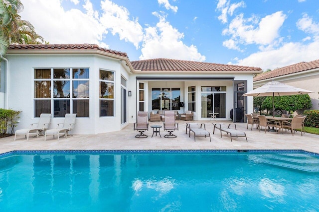 rear view of property featuring a patio