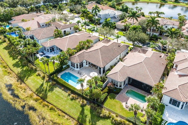 bird's eye view with a water view