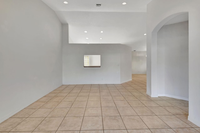 empty room with light tile patterned flooring