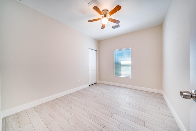 unfurnished room with ceiling fan and light hardwood / wood-style flooring