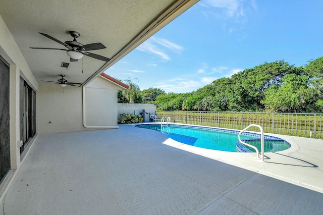 view of pool featuring ceiling fan and a patio area