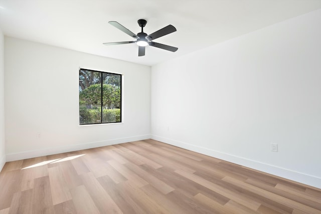 empty room featuring light hardwood / wood-style flooring and ceiling fan