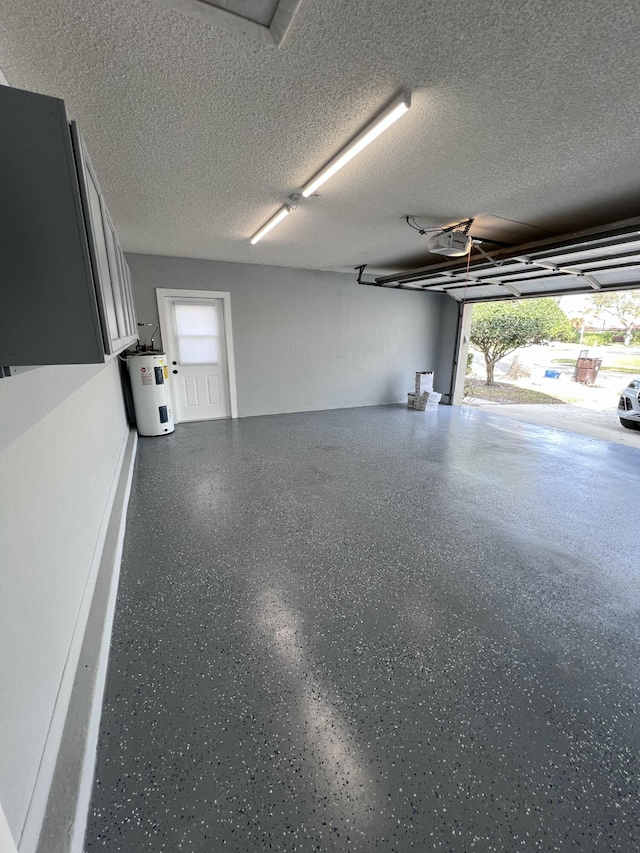 garage featuring a garage door opener and electric water heater