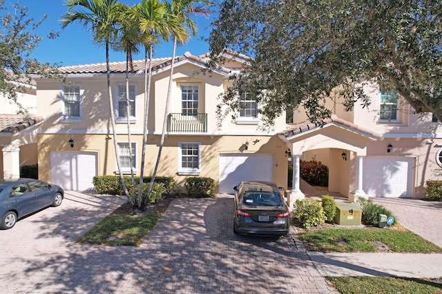 mediterranean / spanish home featuring a garage