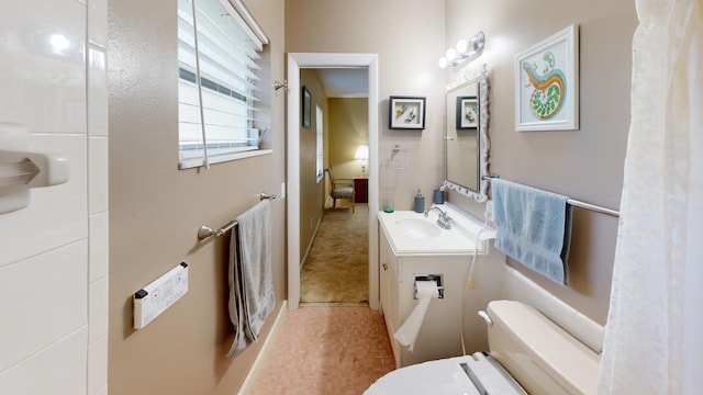 bathroom featuring vanity and toilet