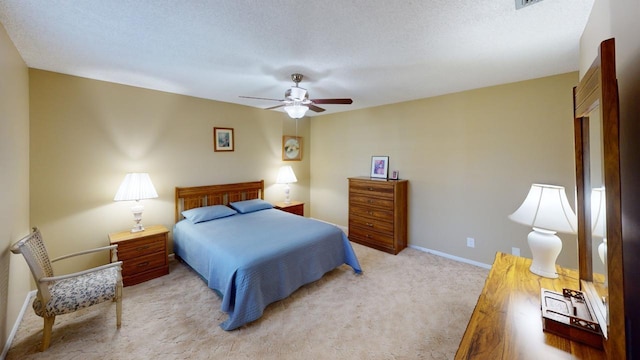 bedroom with light carpet, a textured ceiling, and ceiling fan