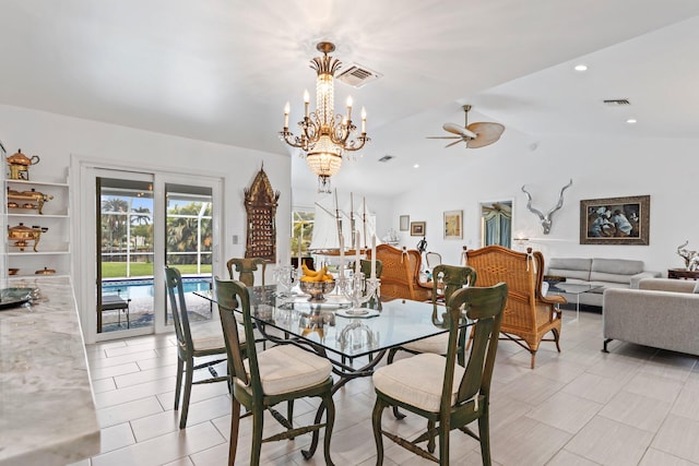 tiled dining space with ceiling fan with notable chandelier and lofted ceiling