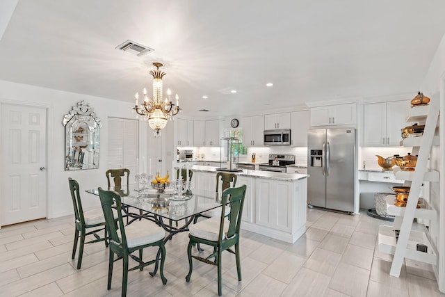 dining room featuring an inviting chandelier