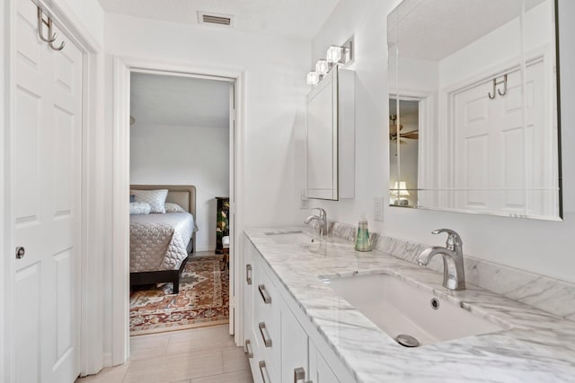 bathroom featuring vanity and a textured ceiling