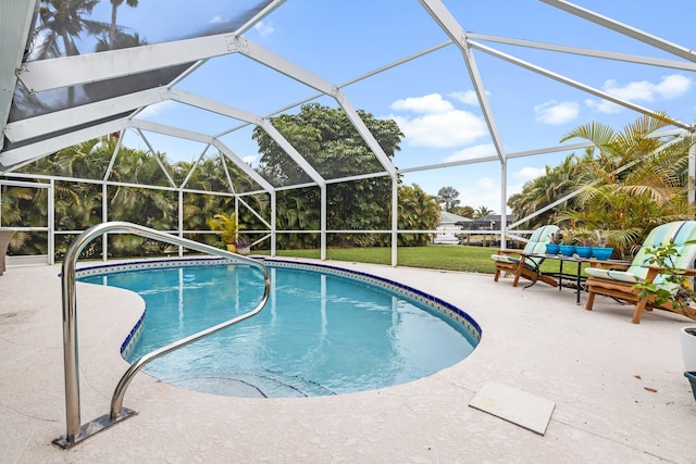 view of pool with a lanai and a patio