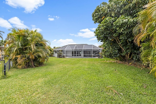 view of yard featuring glass enclosure