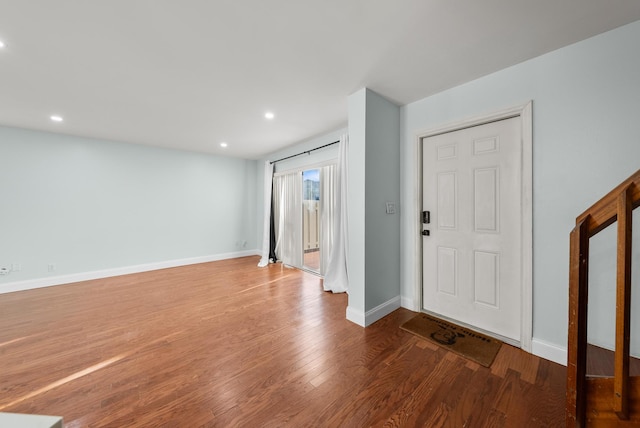 foyer with wood-type flooring