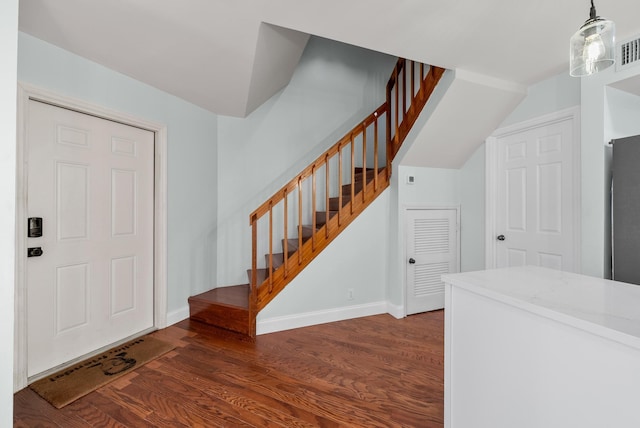 entryway with dark hardwood / wood-style floors