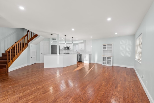 unfurnished living room with hardwood / wood-style floors