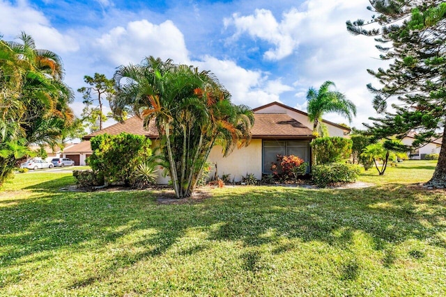 view of property exterior featuring a lawn