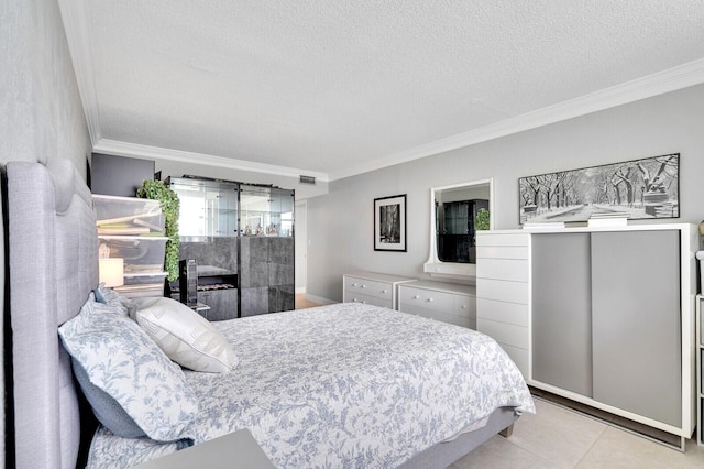 bedroom with light tile patterned flooring, crown molding, and a textured ceiling