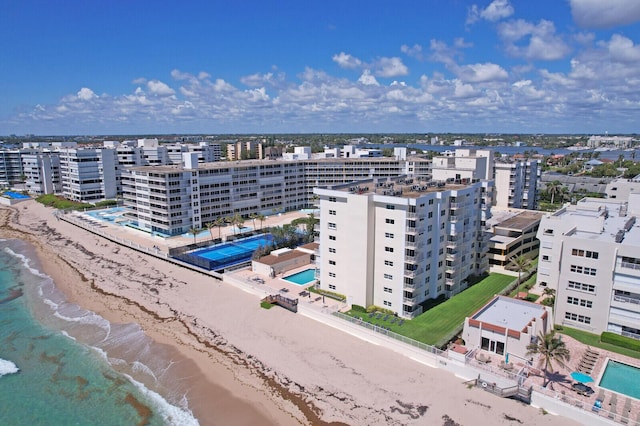 birds eye view of property with a view of the beach and a water view