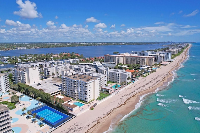 birds eye view of property with a view of the beach and a water view