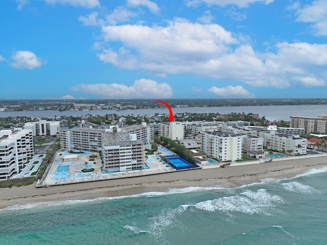 aerial view with a view of the beach and a water view