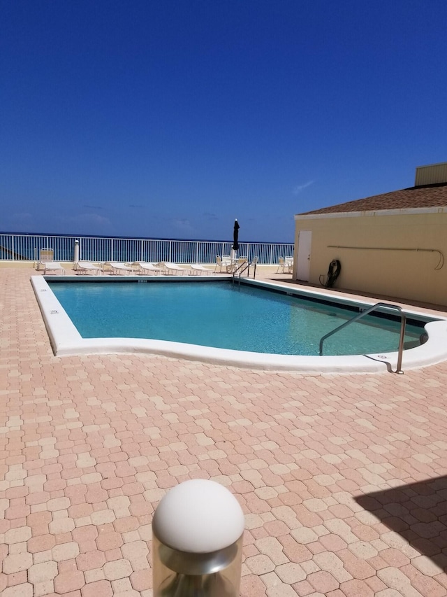 view of swimming pool with a patio area