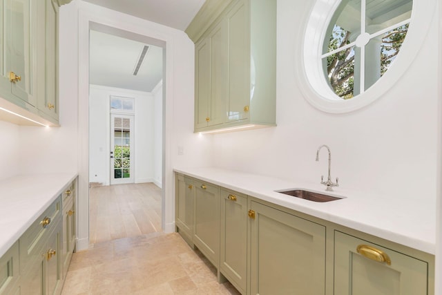 234 Miramar Way, West Palm Beach, FL 33405 - bar area with a sink, baseboards, and light wood finished floors