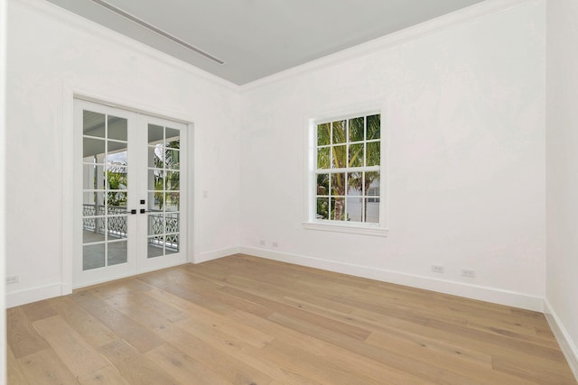 234 Miramar Way, West Palm Beach, FL 33405 - unfurnished room featuring french doors, ornamental molding, light wood-style flooring, and baseboards