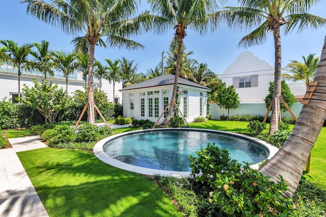 234 Miramar Way, West Palm Beach, FL 33405 - outdoor pool featuring an outdoor structure, an exterior structure, and a lawn