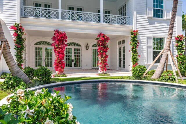 234 Miramar Way, West Palm Beach, FL 33405 - swimming pool featuring french doors
