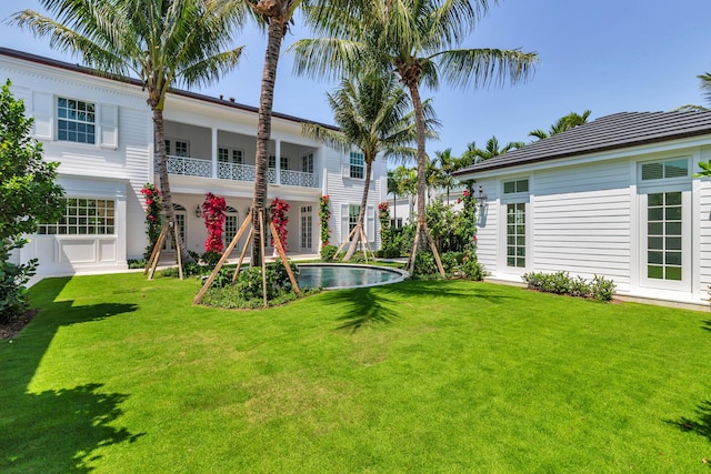 234 Miramar Way, West Palm Beach, FL 33405 - view of grassy yard with an outdoor pool