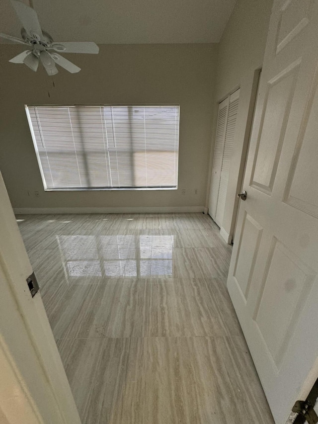 unfurnished room featuring ceiling fan and light hardwood / wood-style flooring