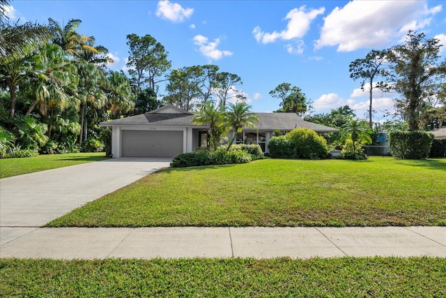 ranch-style house featuring a front yard and a garage