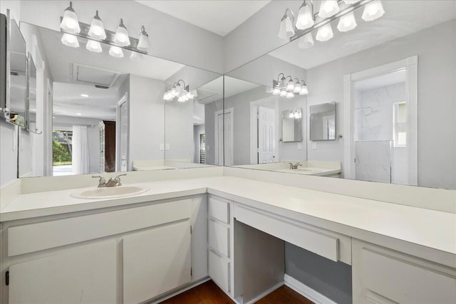 bathroom with a shower, vanity, hardwood / wood-style flooring, and toilet