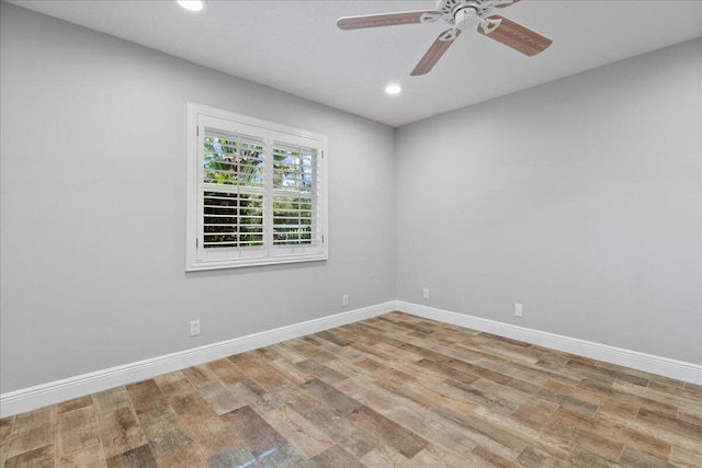 spare room with light hardwood / wood-style floors and ceiling fan