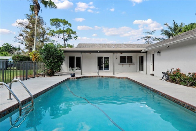 view of swimming pool with a patio and ceiling fan