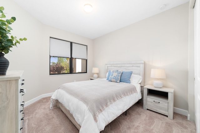 bedroom with light carpet