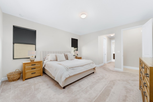 bedroom featuring light colored carpet