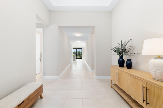 corridor with light tile patterned flooring